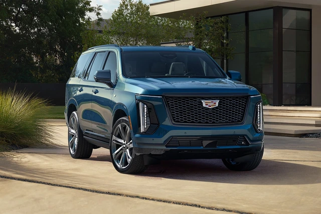 Blue 2026 Cadillac Escalade viewed from a front three-quarter angle